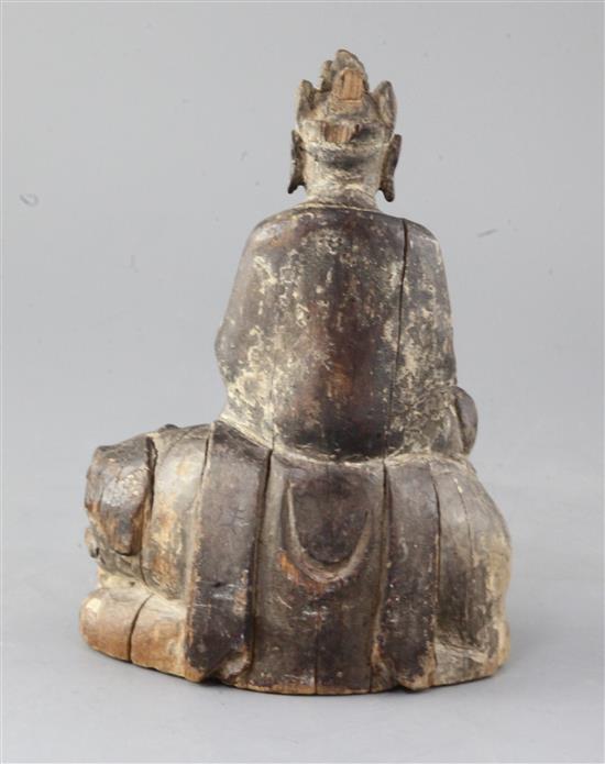 An early Chinese wood group of Wenshu or Manjushri, Song/Yuan dynasty, height 21cm, later stand